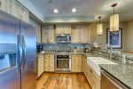 Kitchen with granite countertops and stainless steel appliances